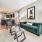 living area with easy access to the kitchen and large hallway leading to a bedroom