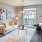 living area with large open spaces and lots of natural lighting through tall windows