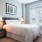 bedroom with ample space for moving around the bed and entering other rooms