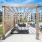 cabanas beside the pool that contain ample seating