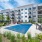 spacious tennis court area beside the pool