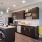 kitchen area on wooden floor with spacious counter-space and designer appliances