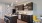 kitchen area on wooden floor with spacious counter-space and designer appliances